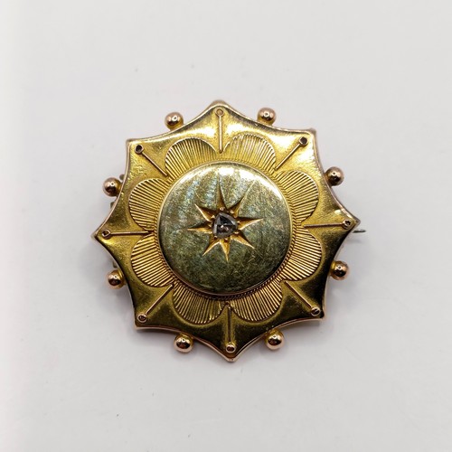 753 - A late 19th/early 20th century yellow metal and diamond memorial brooch