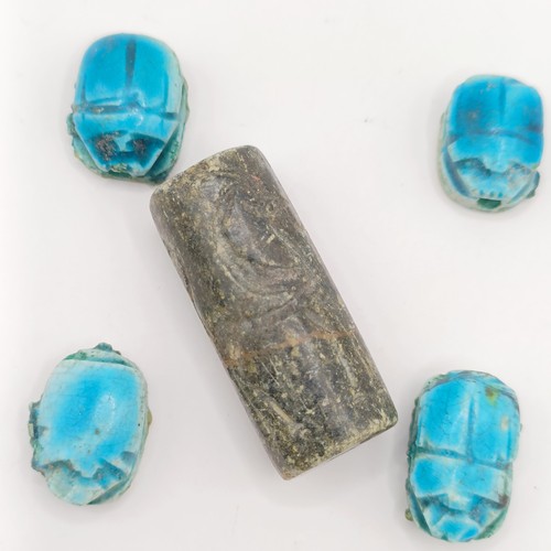 755 - A turquoise glazed Egyptian type scarab, base engraved hieroglyph, three others, and a carved stone ... 