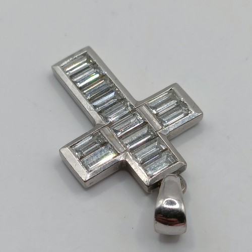 756 - An 18ct white gold and baguette cut diamond cross pendant