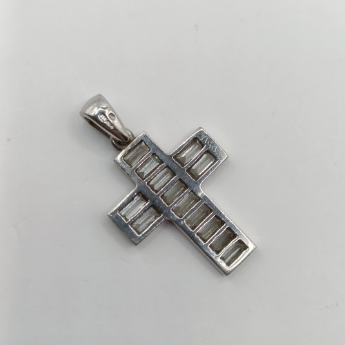 756 - An 18ct white gold and baguette cut diamond cross pendant