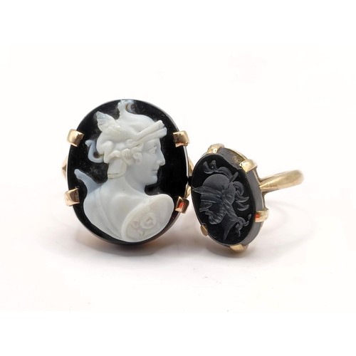 677 - A yellow metal and cameo ring, ring size L, and a yellow metal and intaglio ring, ring size E (2)