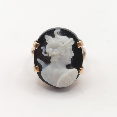 677 - A yellow metal and cameo ring, ring size L, and a yellow metal and intaglio ring, ring size E (2)