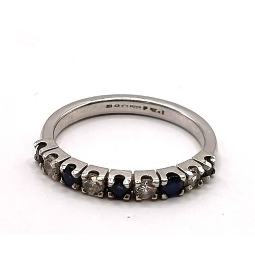 681 - A platinum, diamond and sapphire half eternity ring, ring size L