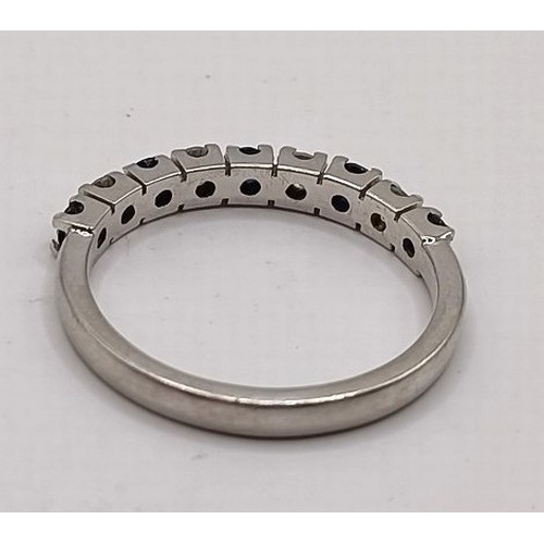 681 - A platinum, diamond and sapphire half eternity ring, ring size L