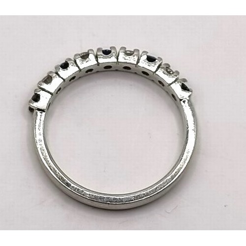 681 - A platinum, diamond and sapphire half eternity ring, ring size L