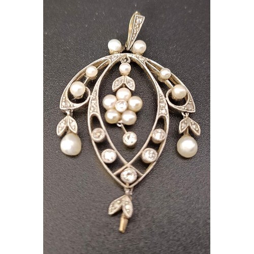 765 - An early 20th century diamond and seed pearl pendant