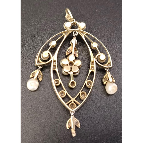 765 - An early 20th century diamond and seed pearl pendant