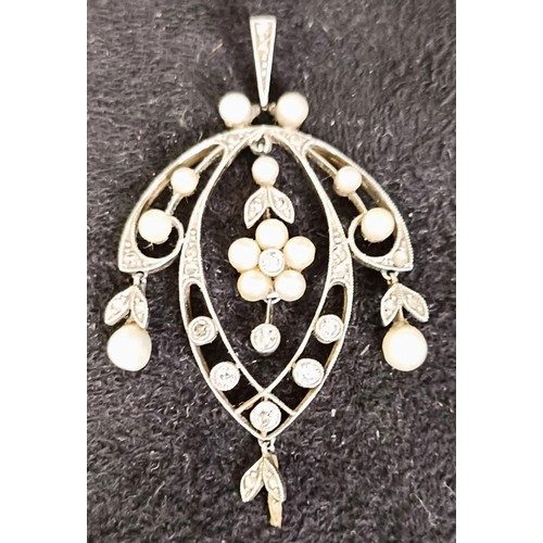 765 - An early 20th century diamond and seed pearl pendant