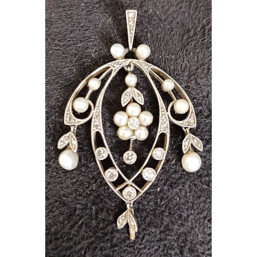 765 - An early 20th century diamond and seed pearl pendant