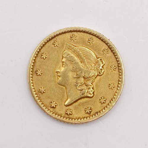 771 - An American gold dollar, 1853