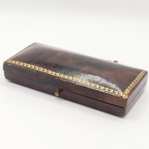 778 - An early 20th century yellow metal and seed pearl bar brooch, in a vintage jewellery box