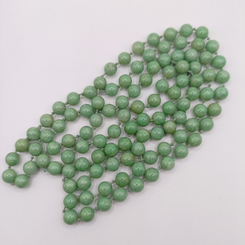 781 - A Chinese green stone bead necklace