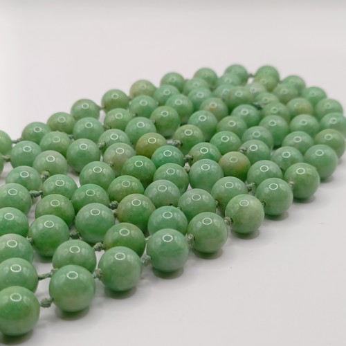 781 - A Chinese green stone bead necklace