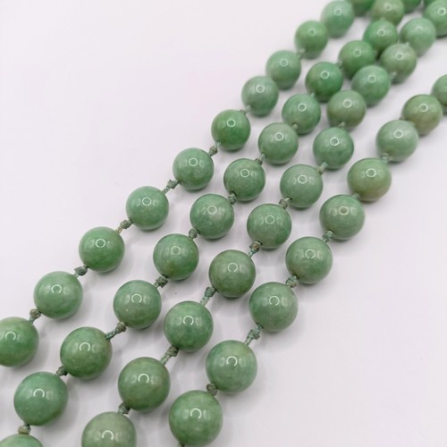 781 - A Chinese green stone bead necklace