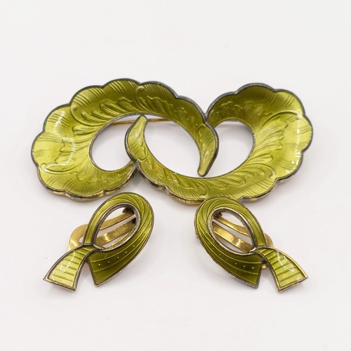 783 - A 1970s silver and green enamel brooch, and a similar pair of earrings (2)