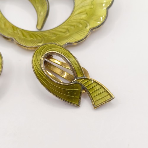 783 - A 1970s silver and green enamel brooch, and a similar pair of earrings (2)