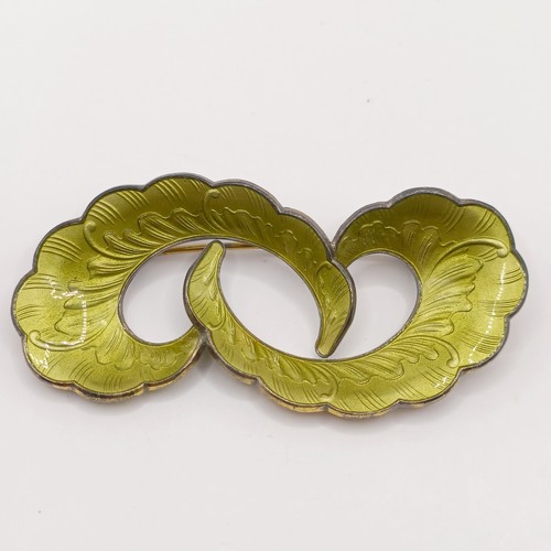 783 - A 1970s silver and green enamel brooch, and a similar pair of earrings (2)