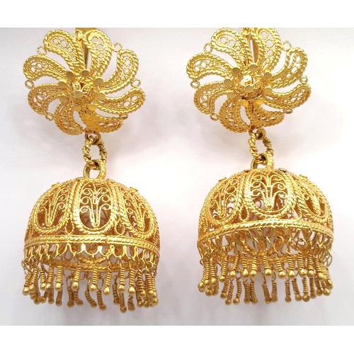 684 - A pair of Indian yellow metal filigree earrings