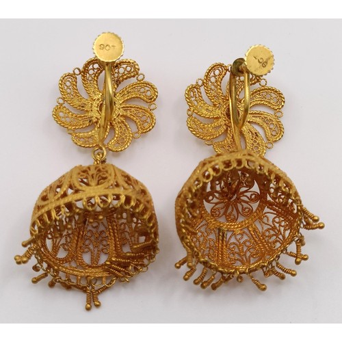 684 - A pair of Indian yellow metal filigree earrings