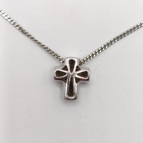 686 - An 18ct white gold and diamond cross pendant, on a chain