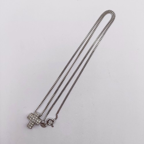 686 - An 18ct white gold and diamond cross pendant, on a chain