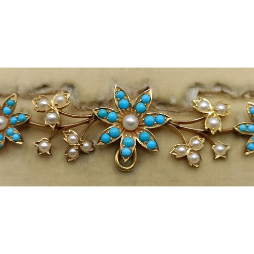 802 - A late 19th/early 20th century yellow metal, turquoise and seed pearl floral necklace, in a fitted j... 