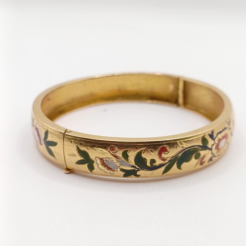 696 - A gold and enamel bangle