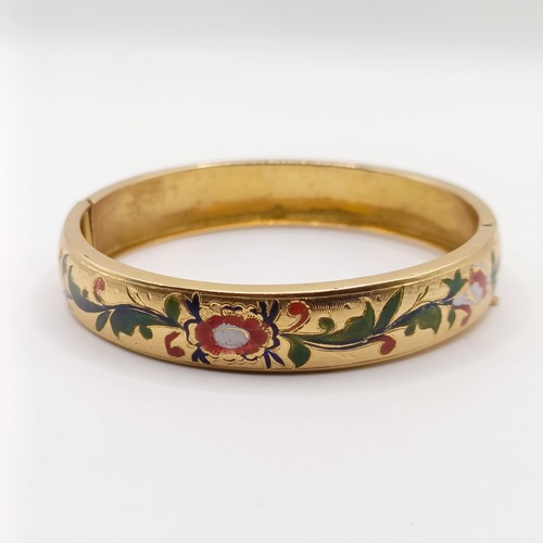 696 - A gold and enamel bangle