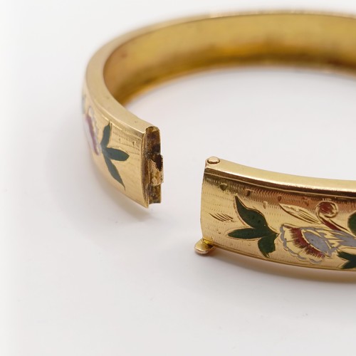 696 - A gold and enamel bangle