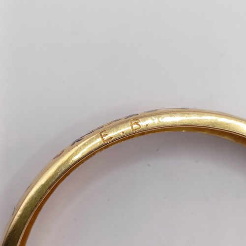 696 - A gold and enamel bangle