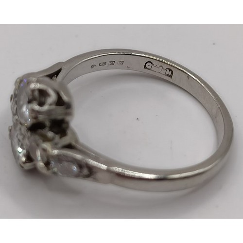 698 - An 18ct white gold and diamond daisy ring, ring size I