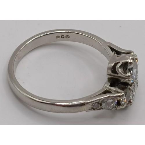 698 - An 18ct white gold and diamond daisy ring, ring size I