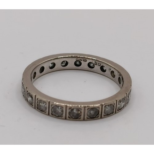 704 - An 18ct gold and diamond eternity ring, ring size M