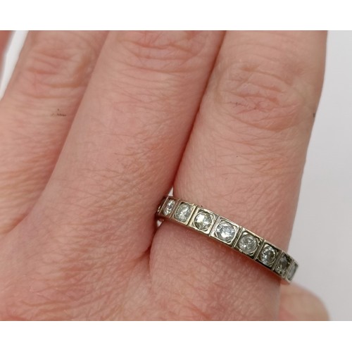 704 - An 18ct gold and diamond eternity ring, ring size M