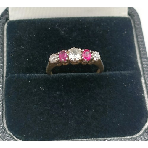 705 - An 18ct gold, ruby and diamond five stone ring, ring size L