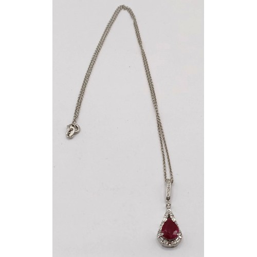 709 - An 18ct white gold, diamond and ruby necklace