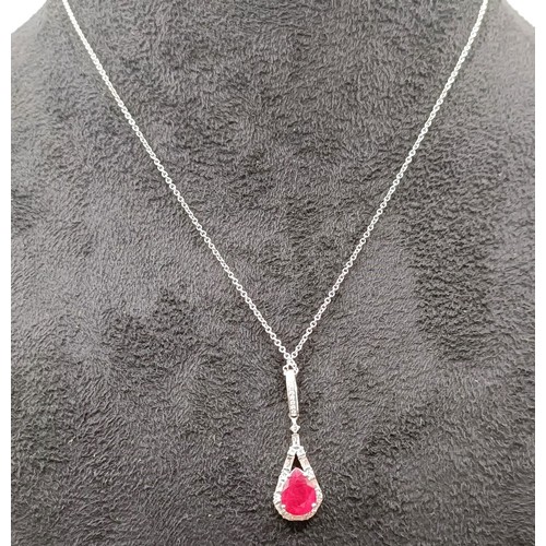 709 - An 18ct white gold, diamond and ruby necklace