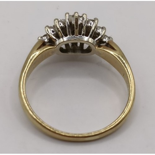 714 - A 9ct gold and diamond cluster ring, ring size H