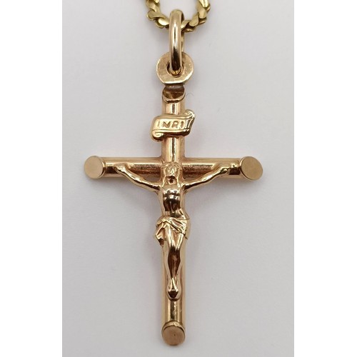 719 - A 9ct gold crucifix, on a chain, 7.1 g