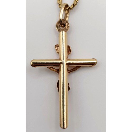 719 - A 9ct gold crucifix, on a chain, 7.1 g