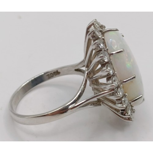 722 - An 18ct white gold, opal and diamond ring, ring size P