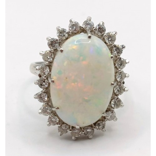 722 - An 18ct white gold, opal and diamond ring, ring size P