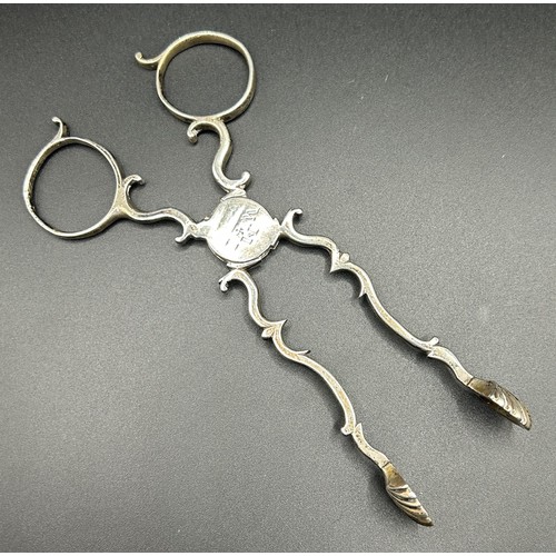 90 - A pair of 18th century silver tongs, initialled, 1.1 ozt