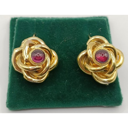 728 - A pair of 18ct gold and garnet earrings