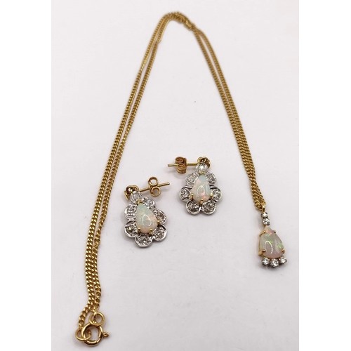 741 - An 18ct gold opal and diamond pendant, on a chain, and a pair of opal earrings