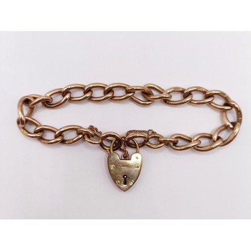 683 - A 9ct gold bracelet, with a heart shaped padlock clasp, 25.3 g