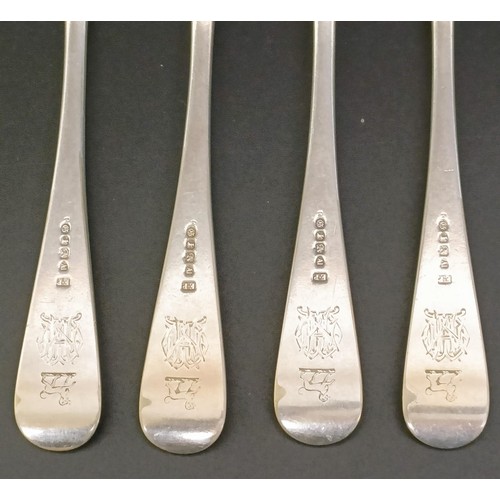 115 - A George III silver fiddle, thread and shell pattern fork, a fiddle pattern fork, four silver spoons... 