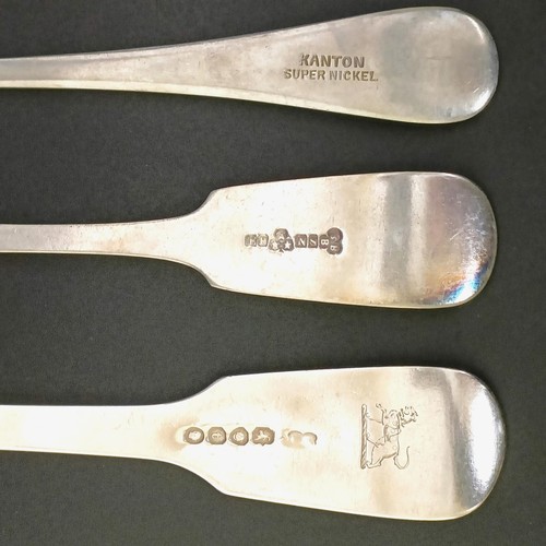 115 - A George III silver fiddle, thread and shell pattern fork, a fiddle pattern fork, four silver spoons... 