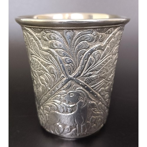 122 - An Indian silver coloured metal beaker, 94 g