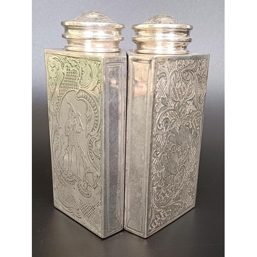 123 - A pair of Continental silver coloured metal triangular caddies, engraved foliate forms and birds, 12... 